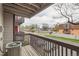 Private balcony providing a view of the neighborhood with nearby street and lush greenery at 6388 Oak Ct # 203, Arvada, CO 80004