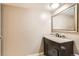 Bathroom featuring a vanity with granite countertop, and mirror at 6388 Oak Ct # 203, Arvada, CO 80004