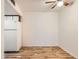 Dining Area featuring refrigerator, wood floors, and ceiling fan at 6388 Oak Ct # 203, Arvada, CO 80004