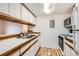 Functional kitchen features white cabinets, laminate countertop, and appliances at 6388 Oak Ct # 203, Arvada, CO 80004