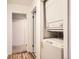 Convenient laundry area featuring a stacked washer and dryer unit at 6388 Oak Ct # 203, Arvada, CO 80004