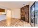 Open concept living area with fireplace and sliding door access to exterior at 6388 Oak Ct # 203, Arvada, CO 80004