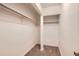 Walk-in Closet showcasing neutral carpeting and clothing racks at 6388 Oak Ct # 203, Arvada, CO 80004