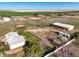 Aerial view showcasing the property's house, barn, and surrounding land at 29881 E 128Th Ave, Commerce City, CO 80022