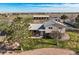 A high aerial showing the front of the home, mature trees, and landscaping at 29881 E 128Th Ave, Commerce City, CO 80022