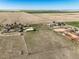 Aerial view of a farm, ranch, or rural estate surrounded by fields, demonstrating space, privacy, and agricultural potential at 29881 E 128Th Ave, Commerce City, CO 80022