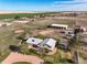 Aerial view shows home with barns, pens, and pasture land surrounded by cultivated fields at 29881 E 128Th Ave, Commerce City, CO 80022