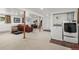 Finished basement with laundry area, neutral carpet, and recessed lighting at 29881 E 128Th Ave, Commerce City, CO 80022