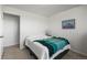 Comfortable bedroom with neutral colors, plush carpeting, and a cozy knitted throw at 29881 E 128Th Ave, Commerce City, CO 80022