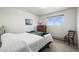 Cozy bedroom with a comfortable bed, wooden dresser, and bright natural light at 29881 E 128Th Ave, Commerce City, CO 80022
