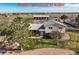Expansive exterior view of the 2 story home on a lot with mature trees and a large outbuilding at 29881 E 128Th Ave, Commerce City, CO 80022