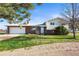 Well maintained home featuring a spacious garage, manicured lawn and a combination of brick and vinyl siding at 29881 E 128Th Ave, Commerce City, CO 80022