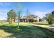 Charming home featuring a spacious front yard, long driveway and a combination of brick and vinyl siding at 29881 E 128Th Ave, Commerce City, CO 80022