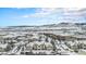 Scenic aerial view of the community with mountain views in the snowy distance at 8358 S Independence Cir # 105, Littleton, CO 80128