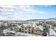 Winter aerial view showcasing the neighborhood's layout and snow-covered rooftops at 8358 S Independence Cir # 105, Littleton, CO 80128
