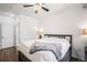Bright bedroom features a comfortable bed with a ceiling fan and neutral-toned walls at 8358 S Independence Cir # 105, Littleton, CO 80128