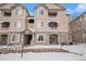 Charming condo building showcasing stone accents, inviting entryways, and well-maintained grounds, ideal for a cozy lifestyle at 8358 S Independence Cir # 105, Littleton, CO 80128