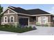 Charming single-story home featuring a two-car garage, stone accents, and manicured front yard at 935 W 128Th Pl, Westminster, CO 80234