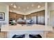 Bright kitchen featuring stainless steel appliances, granite counters, tiled backsplash, and a center island with seating at 935 W 128Th Pl, Westminster, CO 80234