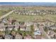 Elevated view of neighborhood with mature trees, bike paths, and expansive mountain views in the distance at 2660 Timberchase Trl, Highlands Ranch, CO 80126