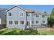 Beautiful two-story home featuring a deck, lush lawn, and mature trees in the backyard at 2660 Timberchase Trl, Highlands Ranch, CO 80126