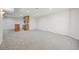 Spacious carpeted basement area with bar, mini fridge, and modern recessed lighting at 2660 Timberchase Trl, Highlands Ranch, CO 80126