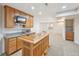Finished basement featuring a wet bar with a sink, stainless steel microwave and granite countertops at 2660 Timberchase Trl, Highlands Ranch, CO 80126