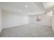 Finished basement with neutral carpet, white walls, and a well-sized window for natural light at 2660 Timberchase Trl, Highlands Ranch, CO 80126