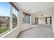 Large bedroom featuring tall ceilings, large windows with backyard views, and carpeted floor at 2660 Timberchase Trl, Highlands Ranch, CO 80126