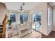 Charming dining area with wood floors, multiple windows, and sliding glass doors to the outdoor deck at 2660 Timberchase Trl, Highlands Ranch, CO 80126