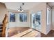 Dining area with hardwood floors, large windows, and sliding glass door to outdoor space at 2660 Timberchase Trl, Highlands Ranch, CO 80126