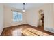Bright dining room featuring wood floors, natural light, and an open doorway to the kitchen at 2660 Timberchase Trl, Highlands Ranch, CO 80126