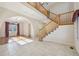 Spacious foyer showcasing a staircase, tile flooring, arched doorways and hardwood flooring in adjacent rooms at 2660 Timberchase Trl, Highlands Ranch, CO 80126