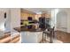Updated kitchen featuring black countertops, stainless steel appliances, and a breakfast bar with seating at 2660 Timberchase Trl, Highlands Ranch, CO 80126