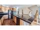 Modern kitchen with stainless steel appliances, granite countertops, and center island at 2660 Timberchase Trl, Highlands Ranch, CO 80126