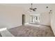 Spacious main bedroom with vaulted ceilings, fan and large windows with natural light at 2660 Timberchase Trl, Highlands Ranch, CO 80126