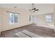 Spacious main bedroom with vaulted ceilings, fan and large windows with natural light at 2660 Timberchase Trl, Highlands Ranch, CO 80126