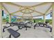 Covered picnic area features multiple tables, providing a comfortable space for outdoor dining and gatherings at 2660 Timberchase Trl, Highlands Ranch, CO 80126