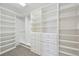Organized walk-in closet with custom shelving and drawers, providing ample storage at 2660 Timberchase Trl, Highlands Ranch, CO 80126