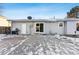 View of backyard patio, showing access from sliding glass door at 10401 W Lehigh Ave, Denver, CO 80235