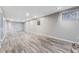 Spacious finished basement with LVP flooring and recessed lighting at 10401 W Lehigh Ave, Denver, CO 80235