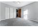 Spacious bedroom with double door closet and window at 10401 W Lehigh Ave, Denver, CO 80235