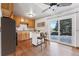 Eat-in kitchen, featuring wood cabinets and an island with seating at 10401 W Lehigh Ave, Denver, CO 80235