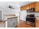 Kitchen with stainless steel appliances and an island at 10401 W Lehigh Ave, Denver, CO 80235