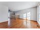 Spacious living room with hardwood floors and large windows at 10401 W Lehigh Ave, Denver, CO 80235