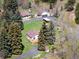 Aerial view of property, home and barn, surrounded by lush foliage at 10039 S Turkey Creek Rd, Morrison, CO 80465