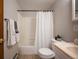 Functional bathroom featuring a shower-tub combo, vanity, and neutral color scheme at 10039 S Turkey Creek Rd, Morrison, CO 80465