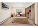 Comfortable bedroom with a plush bed, closet organizer, and neutral decor at 10039 S Turkey Creek Rd, Morrison, CO 80465