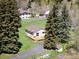 Exterior view of a house with a well maintained lawn and tall trees around it at 10039 S Turkey Creek Rd, Morrison, CO 80465