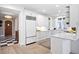 Spacious kitchen with white cabinets, marble countertops and stainless steel appliances at 727 Niagara St, Denver, CO 80220